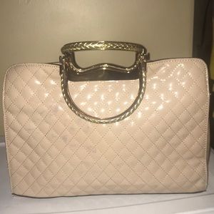 Cream colored bag with gold handles